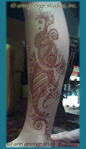 Hula Dancer tattoo on leg red henna tattoo on leg
