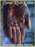 dark red henna color on palm of hand